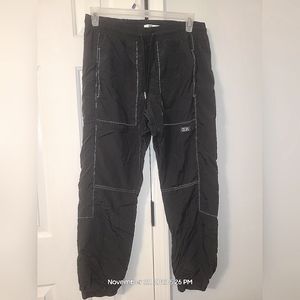 Dope track pants in black reflective